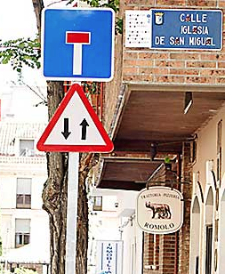 Pegatinas de `caca´ de perro tapan los carteles de Las Rozas